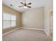 Bedroom featuring plush carpeting, neutral colored walls, and a window for natural light at 5060 Windcrest Lane, Alpharetta, GA 30022