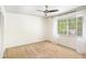 Bedroom with large window, ceiling fan, and plenty of natural light at 6940 Roswell Road Rd # 16B, Atlanta, GA 30328