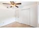 Cozy bedroom featuring a ceiling fan and a double door closet for ample storage space at 6940 Roswell Road Rd # 16B, Atlanta, GA 30328