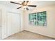 Bedroom with window view of greenery, and ample closet space at 6940 Roswell Road Rd # 16B, Atlanta, GA 30328