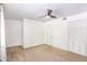 Spacious bedroom features a ceiling fan, closet, and large window overlooking the neighborhood at 6940 Roswell Road Rd # 16B, Atlanta, GA 30328