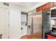 Efficient kitchen featuring stainless steel appliances and stacked washer and dryer units at 6940 Roswell Road Rd # 16B, Atlanta, GA 30328