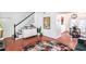 Open-concept living space with modern decor, staircase, dining area, and hardwood floors at 6940 Roswell Road Rd # 16B, Atlanta, GA 30328