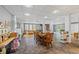 Open basement with tile floors and recreational space including a dining set at 705 S Bethany Rd, Mcdonough, GA 30252