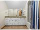 Bathroom with granite countertops, and a shower/tub featuring a new shower curtain at 705 S Bethany Rd, Mcdonough, GA 30252
