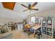 Versatile bonus room with a ceiling fan, desk, sewing table and shelves, perfect for hobbyists or a home office at 705 S Bethany Rd, Mcdonough, GA 30252