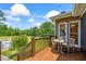 Lovely wood deck overlooking landscaped backyard and gorgeous in-ground swimming pool at 705 S Bethany Rd, Mcdonough, GA 30252