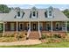 Charming brick home with a welcoming front porch and well-maintained landscaping at 705 S Bethany Rd, Mcdonough, GA 30252
