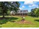 Spacious two-story brick home featuring mature trees, a well and a beautifully landscaped front yard at 705 S Bethany Rd, Mcdonough, GA 30252