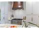 Close up of kitchen with stainless steel oven, white countertops, and white cabinets at 705 S Bethany Rd, Mcdonough, GA 30252
