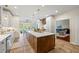 Large eat-in kitchen featuring a beautiful large island, modern white cabinetry, and lots of storage space at 705 S Bethany Rd, Mcdonough, GA 30252