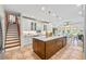 Open concept kitchen with a large island, lots of cabinets, and a cozy eat-in area with lots of light at 705 S Bethany Rd, Mcdonough, GA 30252
