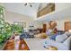 Open concept living room with hardwood floors, high ceilings, and a loft at 705 S Bethany Rd, Mcdonough, GA 30252