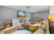 Relaxing finished basement with a spacious sectional sofa and modern entertainment setup at 705 S Bethany Rd, Mcdonough, GA 30252