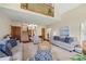 Open concept living room with hardwood floors, high ceilings, and lots of natural light at 705 S Bethany Rd, Mcdonough, GA 30252