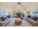 Open living room featuring vaulted ceiling, lots of natural light, and brick fireplace at 705 S Bethany Rd, Mcdonough, GA 30252