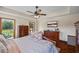 Bright bedroom featuring hardwood floors, recessed lights, ceiling fan and backyard access at 705 S Bethany Rd, Mcdonough, GA 30252