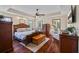 Spacious bedroom offering hardwood floors, recessed lighting, and a tray ceiling at 705 S Bethany Rd, Mcdonough, GA 30252