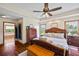 Relaxing bedroom featuring wood floors, recessed lighting, and doorway to the bathroom at 705 S Bethany Rd, Mcdonough, GA 30252