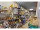 Pantry stocked with canned goods and supplies on metal shelves with concrete walls at 705 S Bethany Rd, Mcdonough, GA 30252