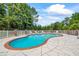 Large in-ground pool with concrete surround and white fence, perfect for hot summer days at 705 S Bethany Rd, Mcdonough, GA 30252