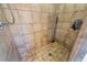 Walk-in shower featuring tiled walls and floors, plus a shower head at 705 S Bethany Rd, Mcdonough, GA 30252