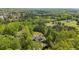 Overhead view of a secluded home nestled among lush trees, showcasing its private, wooded surroundings at 922 Florence Rd, Douglasville, GA 30134