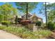 Inviting exterior featuring stone accents, a manicured front garden, and an elegant entryway at 922 Florence Rd, Douglasville, GA 30134