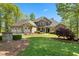 Beautiful home with stone accents, a three-car garage, and lush landscaping at 922 Florence Rd, Douglasville, GA 30134