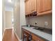 Hallway has a built-in desk, wooden cabinets, gray countertop, and a wooden stool at 922 Florence Rd, Douglasville, GA 30134