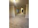 Expansive living room features tray ceilings and neutral carpet at 2304 Northglenn Ct, Conyers, GA 30013