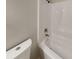 The bathroom features a white shower-tub combo, with modern fixtures and neutral walls at 365 Wesley Mill Pl, Villa Rica, GA 30180