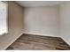 This bedroom features wood flooring, and a window letting in natural light at 365 Wesley Mill Pl, Villa Rica, GA 30180
