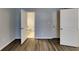 Bright bedroom with multiple doors, light blue walls, and wood-look flooring at 365 Wesley Mill Pl, Villa Rica, GA 30180