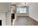 Dining room boasts hardwood floors and great natural light adjacent to the kitchen at 365 Wesley Mill Pl, Villa Rica, GA 30180