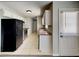 Efficient kitchen featuring stainless steel appliances, white cabinetry, and tile flooring at 365 Wesley Mill Pl, Villa Rica, GA 30180