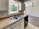Kitchen area with double sink, wood countertops and a window that provides ample natural lighting at 365 Wesley Mill Pl, Villa Rica, GA 30180