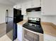 Updated kitchen with sleek stainless steel appliances, white cabinets and modern hardware at 365 Wesley Mill Pl, Villa Rica, GA 30180