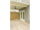 A view of the back porch, showing wood flooring, outdoor fan, and french doors to enter the property at 559 Fundao Ln # 21, Lawrenceville, GA 30046