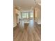Bright, open-concept living space with recessed lighting, hardwood floors, and lots of natural light at 559 Fundao Ln # 21, Lawrenceville, GA 30046