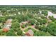 Expansive aerial view of a beautiful lakeside neighborhood surrounded by lush greenery and mature trees at 1065 Bookhout Drive Dr, Cumming, GA 30041