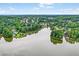 Beautiful aerial view of a lake and surrounding community with lush greenery at 1065 Bookhout Drive Dr, Cumming, GA 30041