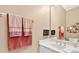 Bathroom featuring a white vanity with double sinks and modern fixtures at 1065 Bookhout Drive Dr, Cumming, GA 30041