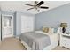 Cozy bedroom features a ceiling fan, window, and ensuite bathroom at 1065 Bookhout Drive Dr, Cumming, GA 30041