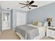 Cozy bedroom with double closet doors and adjacent bathroom entrance at 1065 Bookhout Drive Dr, Cumming, GA 30041