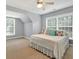 Bedroom with ample sunlight from two windows, ceiling fan, and neutral color scheme at 1065 Bookhout Drive Dr, Cumming, GA 30041