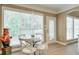 Bright breakfast nook with a table, chairs, and a large window at 1065 Bookhout Drive Dr, Cumming, GA 30041