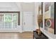 Bright foyer featuring high ceilings, natural light, decorative art, and wood-look flooring at 1065 Bookhout Drive Dr, Cumming, GA 30041