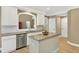 Modern kitchen with stainless steel appliances, granite countertops, and a functional island at 1065 Bookhout Drive Dr, Cumming, GA 30041
