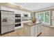 Modern kitchen with stainless steel appliances and a center island at 1065 Bookhout Drive Dr, Cumming, GA 30041